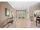 Spacious living room with light beige sofas and access to backyard at 25515 Hawks Run Ln, Sorrento, FL 32776