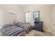 Bedroom with two twin beds, dresser, and TV at 25515 Hawks Run Ln, Sorrento, FL 32776