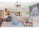 Relaxing living room with curved sectional sofa and ottoman at 25515 Hawks Run Ln, Sorrento, FL 32776