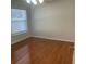 Bright bedroom with laminate wood floors and window at 3501 Beau Chene Dr, Kissimmee, FL 34746