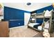 Star Wars themed bedroom with bunk beds and blue walls at 7252 Oakmoss Loop, Davenport, FL 33837