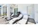 Relaxing patio with lounge chairs and a grill for outdoor dining at 7252 Oakmoss Loop, Davenport, FL 33837