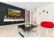 Game room with comfortable seating and large TV at 7252 Oakmoss Loop, Davenport, FL 33837