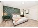 Spacious bedroom with a king-size bed and stylish wall decor at 7252 Oakmoss Loop, Davenport, FL 33837