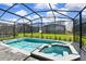 Inviting screened pool and spa with lounge chairs and outdoor dining at 7252 Oakmoss Loop, Davenport, FL 33837