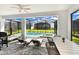 Outdoor patio features a dining area, lounge chairs, and grill at 7252 Oakmoss Loop, Davenport, FL 33837
