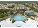 Resort-style pool with surrounding lounge chairs and a basketball court at 8100 Princess Palm Ln # 303, Kissimmee, FL 34747