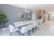 Bright dining room with white table and chairs at 9076 Hazard St, Davenport, FL 33896