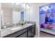 ' bathroom with double sinks, granite countertop, and Frozen theme at 9076 Hazard St, Davenport, FL 33896