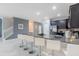 Modern kitchen features granite countertops and stainless steel appliances at 9076 Hazard St, Davenport, FL 33896