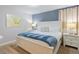 Bedroom with king-size bed and neutral decor at 9076 Hazard St, Davenport, FL 33896