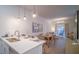 Open concept kitchen with island and stainless steel appliances at 387 Famagusta Dr, Davenport, FL 33896