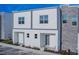Modern two-unit building with gray and white exterior at 387 Famagusta Dr, Davenport, FL 33896