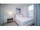 Cozy bedroom with a full-size bed, nightstand, and window at 387 Famagusta Dr, Davenport, FL 33896