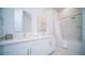 Modern bathroom with double vanity, white cabinets, and a large walk-in shower at 387 Famagusta Dr, Davenport, FL 33896