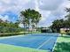 Well-maintained tennis court in a residential community at 9220 Hidden Stream Ct, Orlando, FL 32825