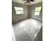 Well-lit bedroom with tile floors and multiple windows at 520 Avenue L Se, Winter Haven, FL 33880