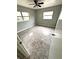 Bright bedroom with tile flooring and ceiling fan at 520 Avenue L Se, Winter Haven, FL 33880