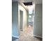 Clean hallway with tile flooring at 520 Avenue L Se, Winter Haven, FL 33880