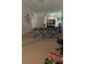 Living room features a floral sofa and carpet flooring at 2135 Sw 156Th Pl, Ocala, FL 34473