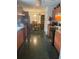 Eat-in kitchen with wood cabinets and dark tile floor at 2135 Sw 156Th Pl, Ocala, FL 34473