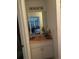 Bathroom vanity with mirror and storage at 2135 Sw 156Th Pl, Ocala, FL 34473