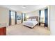 King-size bed with nightstands and window at 601 Lasso Dr, Kissimmee, FL 34747