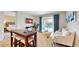 Gathering room with comfortable seating, a TV, and access to the pool at 601 Lasso Dr, Kissimmee, FL 34747