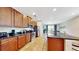 Spacious kitchen with dark wood cabinets and granite countertops at 601 Lasso Dr, Kissimmee, FL 34747