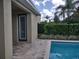 Pool area with patio and access to a storage area at 601 Lasso Dr, Kissimmee, FL 34747