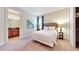 Bedroom with a queen bed, en-suite bathroom, and a closet at 601 Lasso Dr, Kissimmee, FL 34747