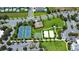 Aerial view of community amenities including tennis courts and a playground at 601 Lasso Dr, Kissimmee, FL 34747