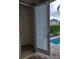 Sliding patio door with white blinds leading to the pool at 601 Lasso Dr, Kissimmee, FL 34747