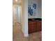 Kitchen wet bar with granite countertop and cabinets at 601 Lasso Dr, Kissimmee, FL 34747