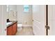 Small bathroom with toilet and single vanity at 601 Lasso Dr, Kissimmee, FL 34747