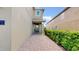 Inviting entryway with a brick walkway and lush landscaping at 601 Lasso Dr, Kissimmee, FL 34747