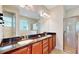 Double vanity bathroom with granite countertop and shower at 601 Lasso Dr, Kissimmee, FL 34747