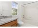 Clean bathroom with shower/tub combo and wood vanity at 114 Eastpark Dr, Celebration, FL 34747