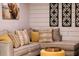 Cozy basement sitting area with L-shaped sofa and wood accents at 4600 Nebraska Ave, Sanford, FL 32771