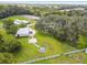 Aerial view of the property highlighting a fire pit and expansive lawn at 4600 Nebraska Ave, Sanford, FL 32771