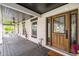 Front porch detail showcasing the wooden door and porch flooring at 4600 Nebraska Ave, Sanford, FL 32771
