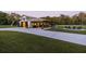 White barn with a long driveway and a fire pit area at 4600 Nebraska Ave, Sanford, FL 32771