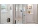 Clean shower with tiled walls and a glass door at 4600 Nebraska Ave, Sanford, FL 32771
