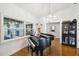 Bright dining room featuring hardwood floors and a grand piano at 4600 Nebraska Ave, Sanford, FL 32771
