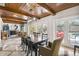 Bright dining room features a large table, wood ceiling, and access to the pool at 4600 Nebraska Ave, Sanford, FL 32771