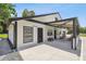 Guest house with a covered porch and rocking chairs at 4600 Nebraska Ave, Sanford, FL 32771