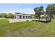 White barn with black accents and large doors at 4600 Nebraska Ave, Sanford, FL 32771
