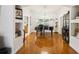 Elegant dining room with hardwood floors and a grand piano at 4600 Nebraska Ave, Sanford, FL 32771