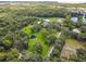 Aerial view showcasing a spacious property with a pond and extensive green space at 4600 Nebraska Ave, Sanford, FL 32771