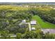 Aerial view of a large property with equestrian facilities and lush landscaping at 4600 Nebraska Ave, Sanford, FL 32771